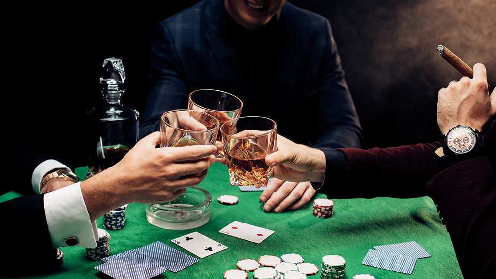 Men toasting at poker table